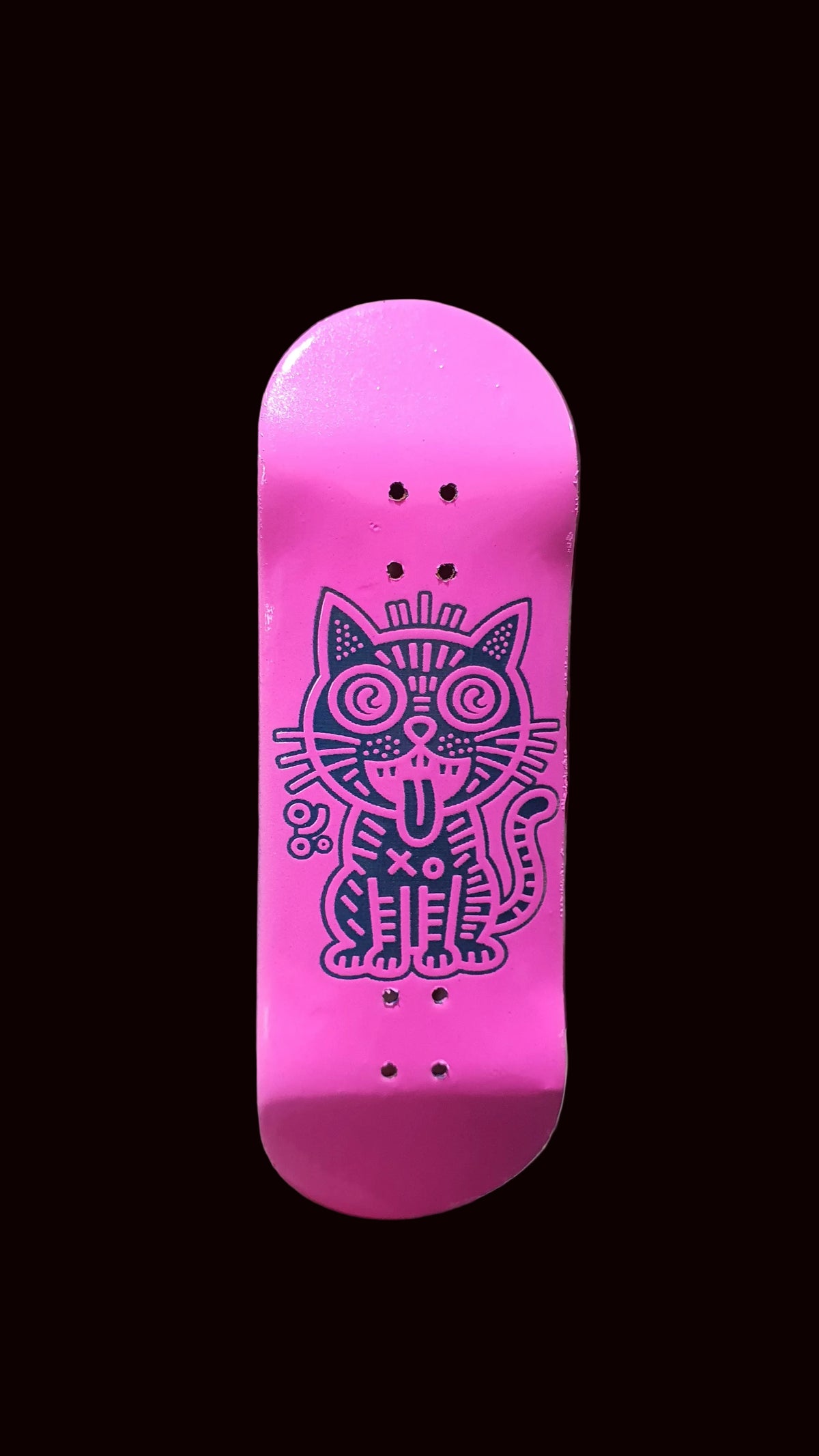 Pink fingerboard deck with upright purple cat graphic and multiple bolt holes