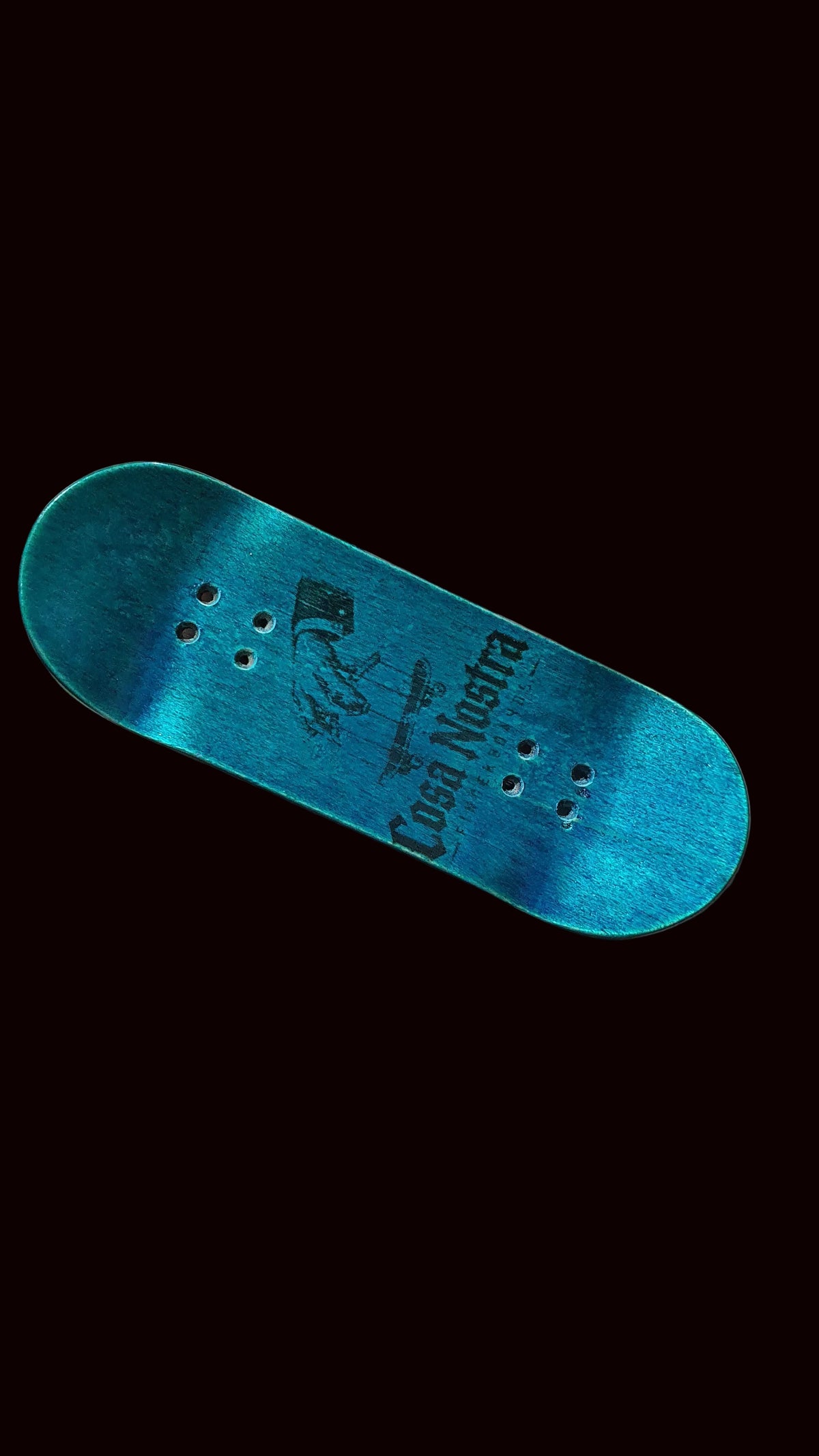 Blue teal fingerboard deck, angled view with graphic center and six mounting holes.