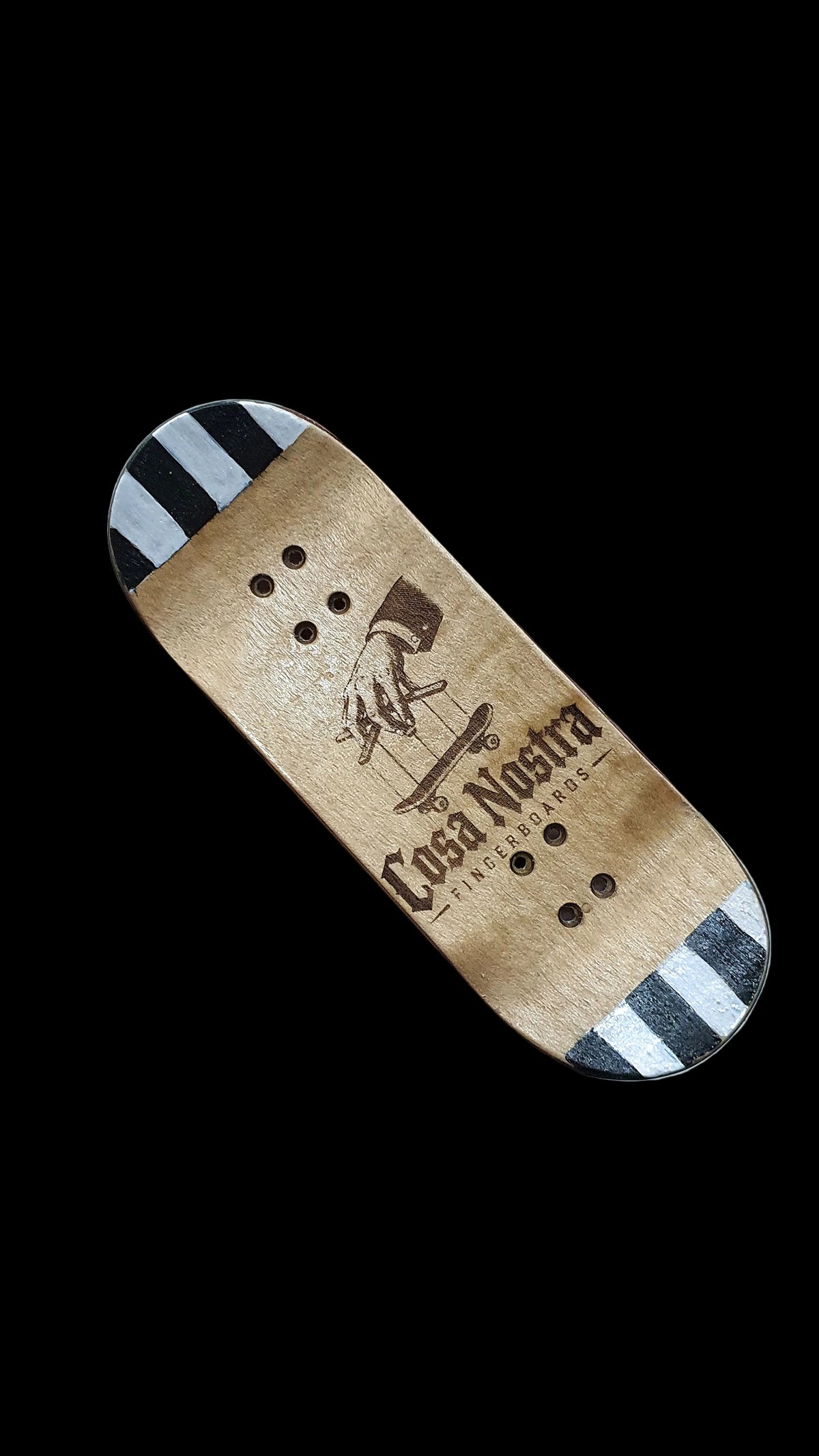 Tan skateboard deck angled view with Cosa Nostra logo and graphic, black-and-white striped ends