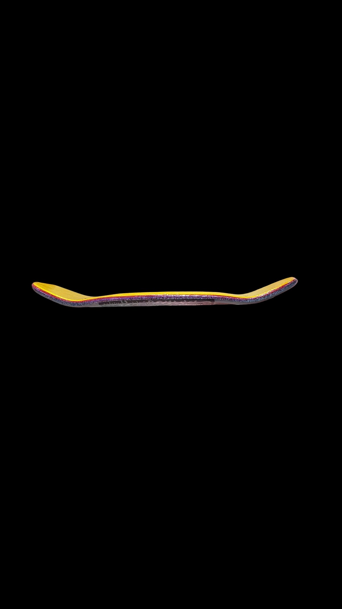 Saigon Skateboards fingerboard deck side profile showing curved ends and layered construction