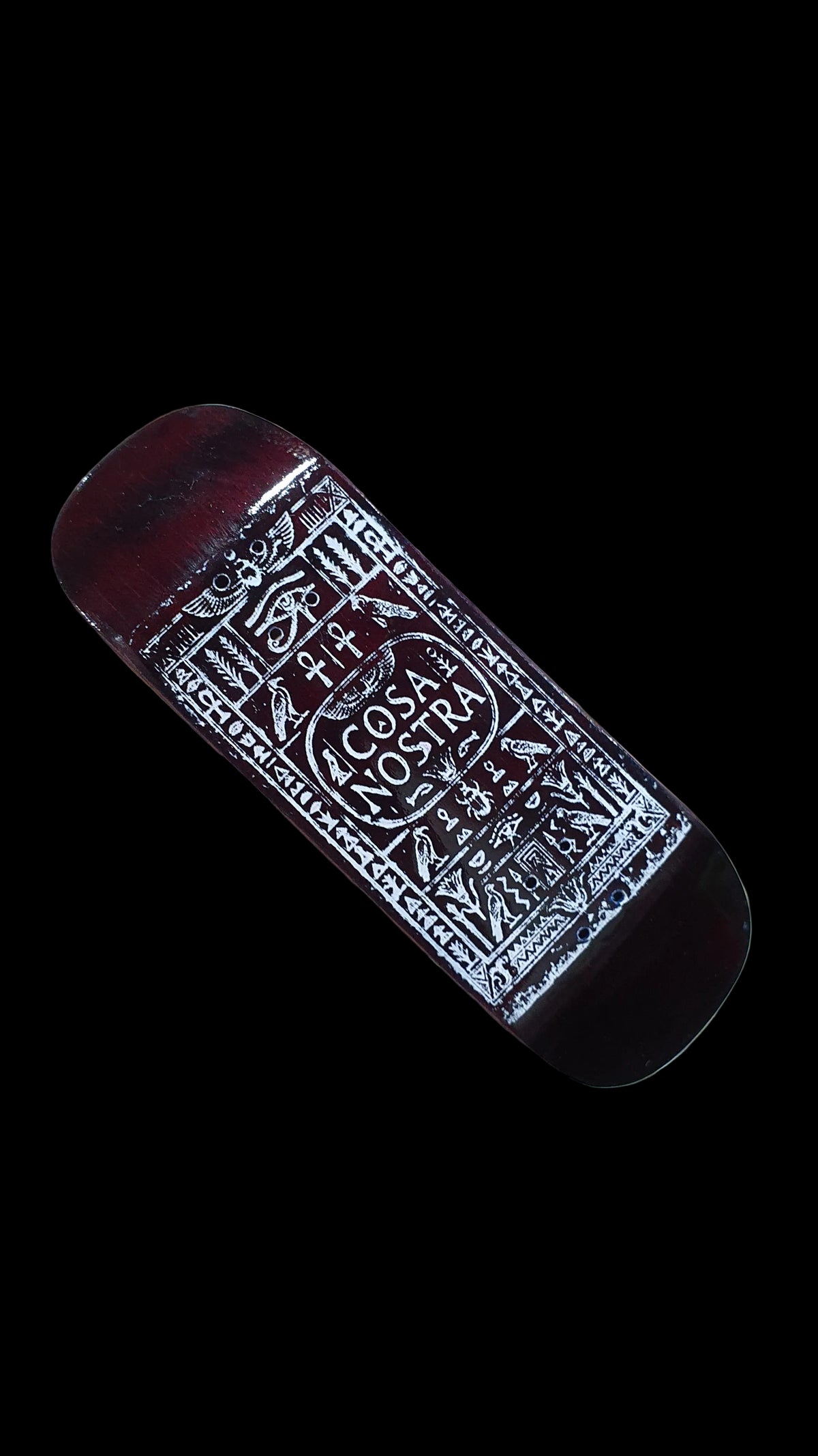 Diagonal view of the fingerboard's red-brown underside and detailed white graphic