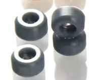 Set of four black fingerboard wheels with white bearings.