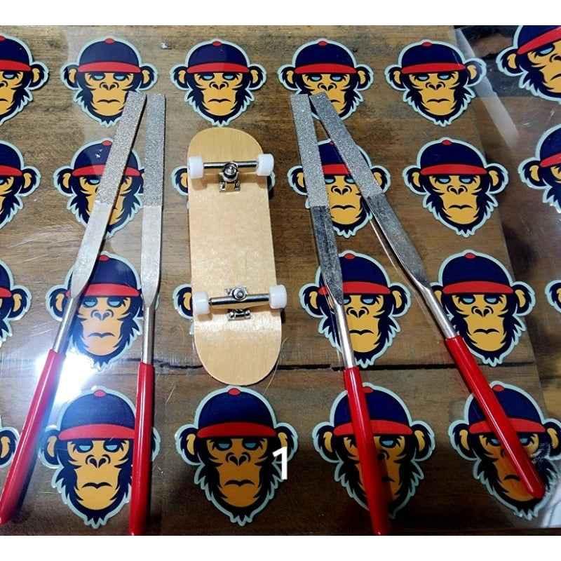 Custom fingerboard deck with shaping files on a background of monkey stickers