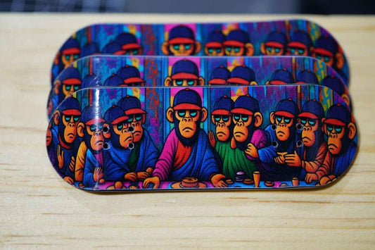 Three custom fingerboard decks featuring colorful monkey character artwork