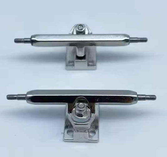Two miniature metal fingerboard trucks for custom fingerboard builds