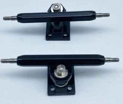 Pair of black professional fingerboard trucks for custom fingerboard builds.