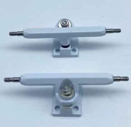 Pair of light grey custom fingerboard trucks for miniature skateboards.