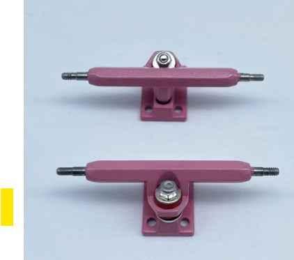 Pair of pink custom fingerboard trucks for miniature skateboards.
