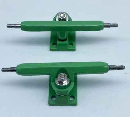 Pair of green custom fingerboard trucks for miniature skateboards.