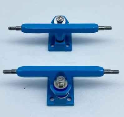 Two blue miniature fingerboard trucks with metal axles on a white background.