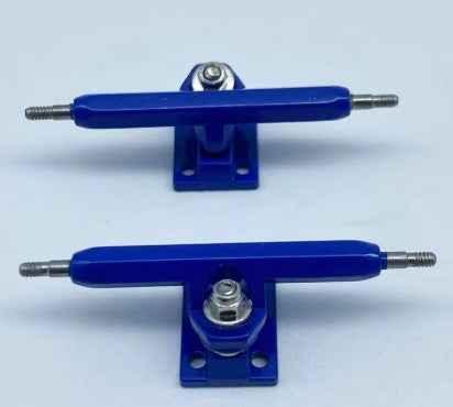 Two blue fingerboard trucks with silver hardware on a white background