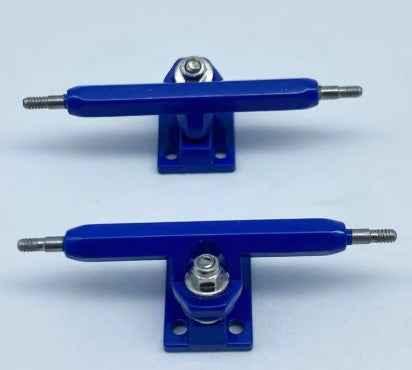Two blue metal fingerboard trucks for custom miniature skateboards.