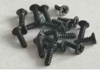 Set of small black fingerboard hardware screws for custom fingerboard builds.