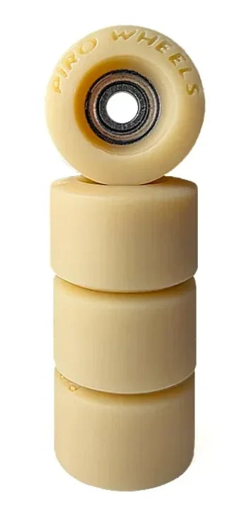 Four cream-colored Piro Wheels fingerboard wheels stacked vertically on a white background.