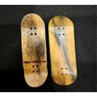 Two handmade wooden fingerboard decks with natural wood grain texture.