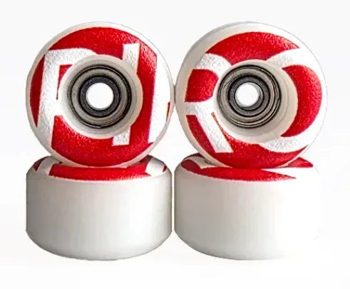 Pair of custom red and white patterned fingerboard wheels with metal bearings.