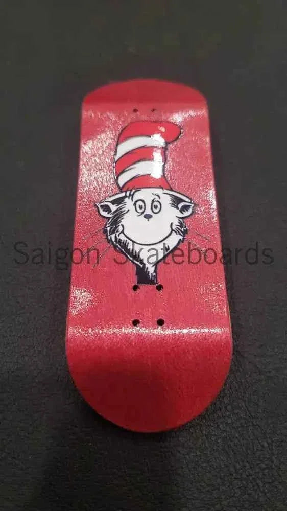 Red custom fingerboard deck featuring a cat wearing a red and white striped hat