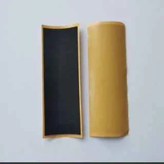 A wooden fingerboard storage case with a black interior lining.