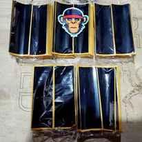 Set of black fingerboard grip tapes with a monkey graphic design