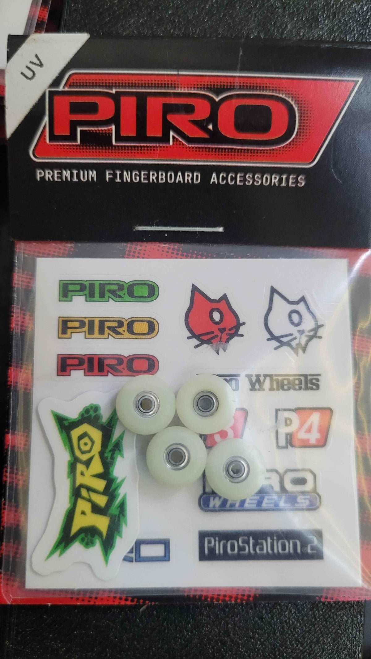 Piro premium fingerboard accessory set with wheels, stickers, and UV protection.