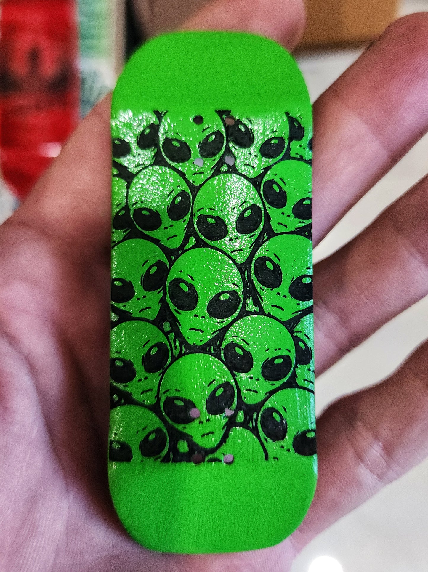 Custom handmade fingerboard deck with neon green alien head graphic design