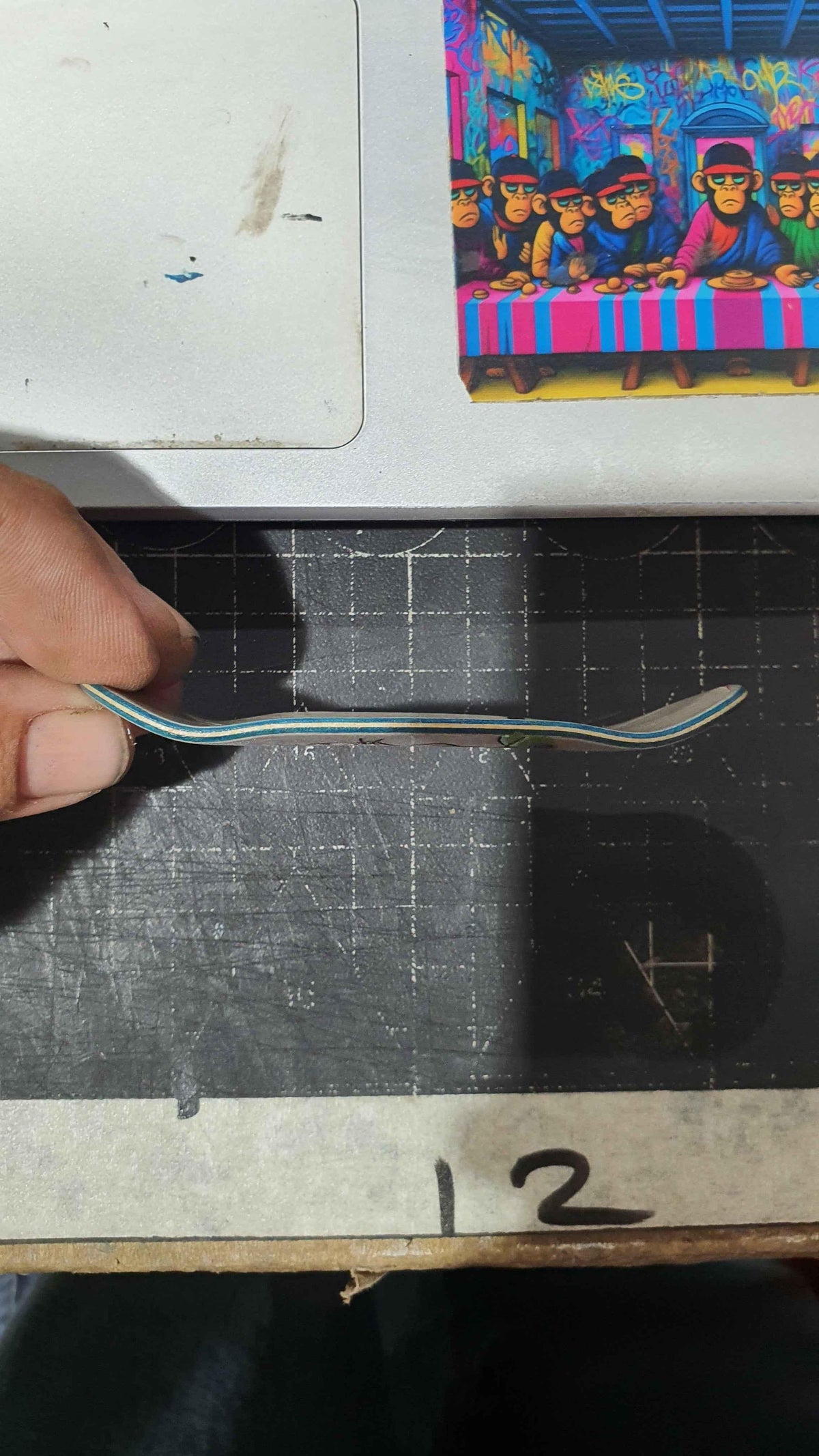Saigon Skateboard Mace fingerboard deck, close-up of mace graphic detail