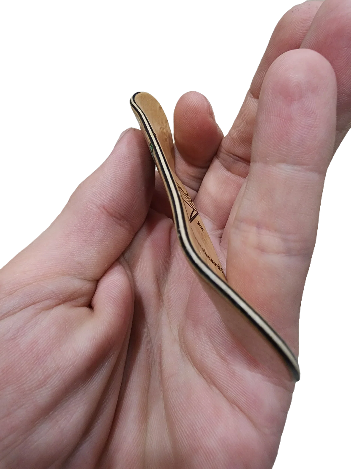 A person holding a handmade wooden fingerboard deck in their hand