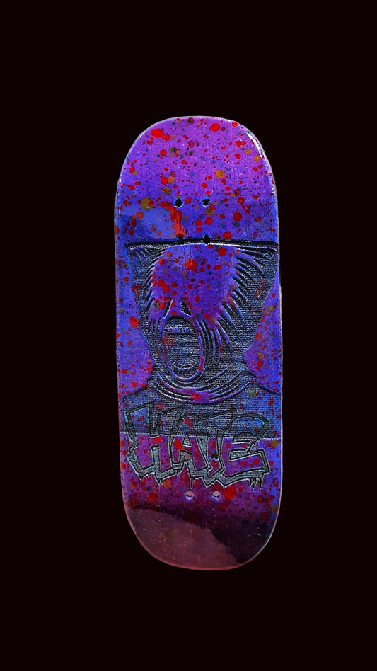 Purple fingerboard deck front view with animal face and 'HATE' text near bottom.