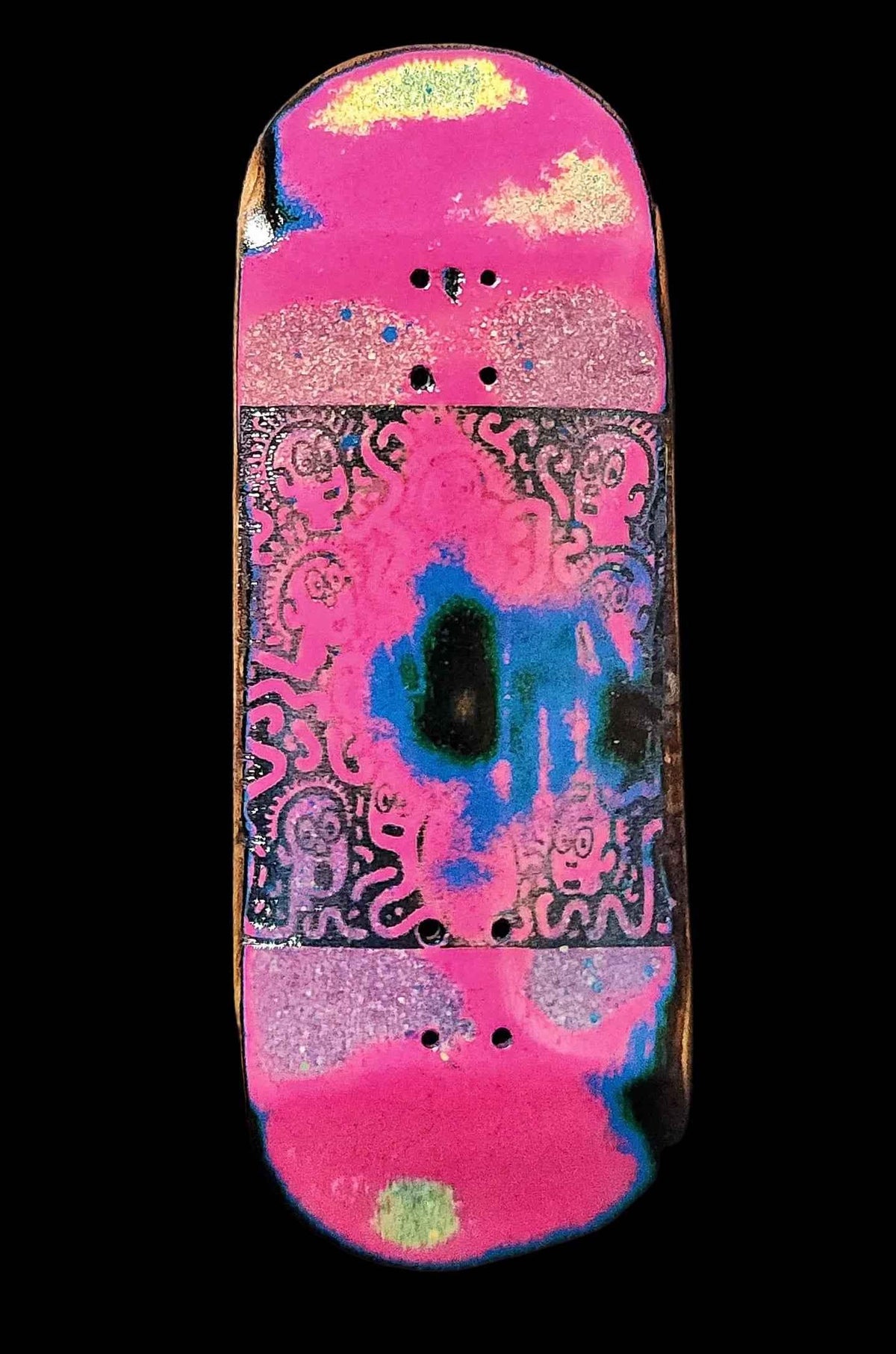 Custom handmade fingerboard deck with a vibrant pink and blue psychedelic design