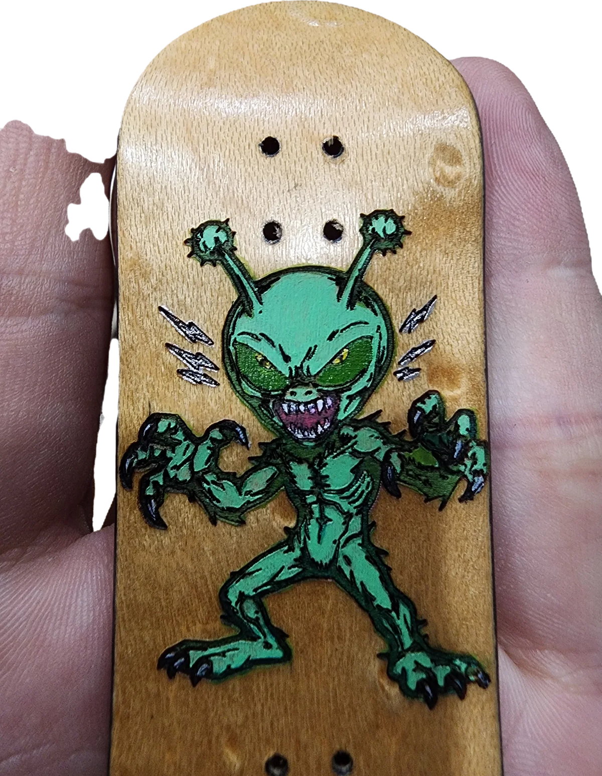 Handmade custom fingerboard deck featuring a green alien monster graphic