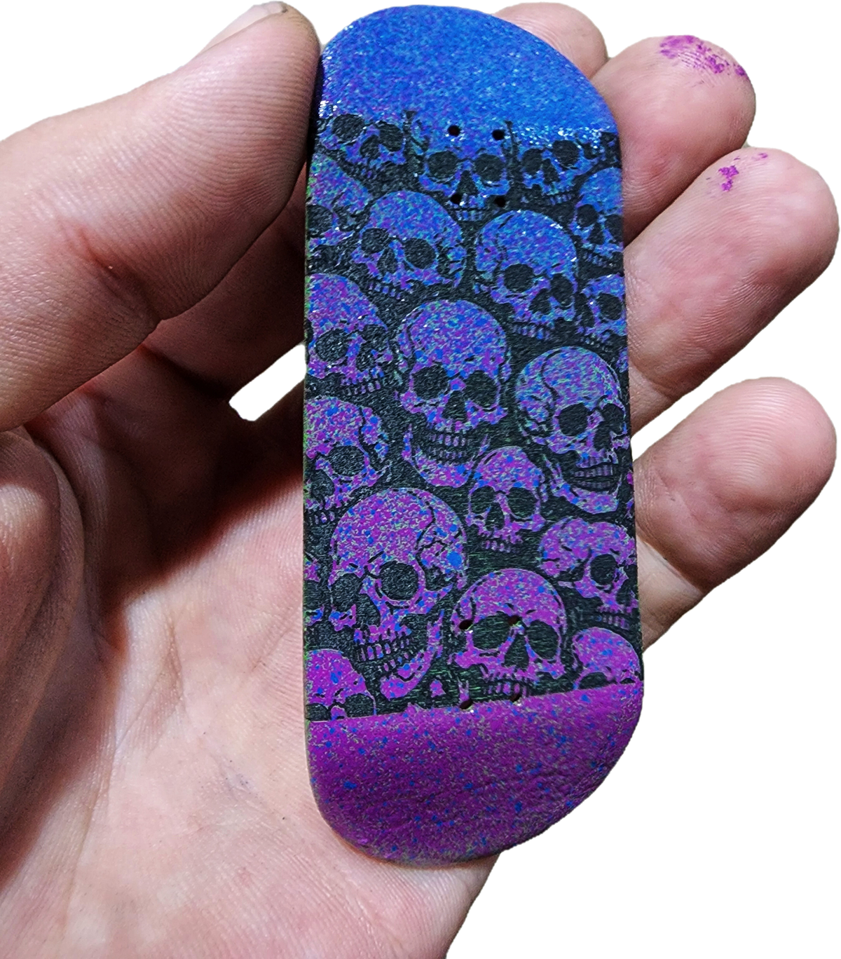 Handmade custom fingerboard deck with purple and black skull graphic design.