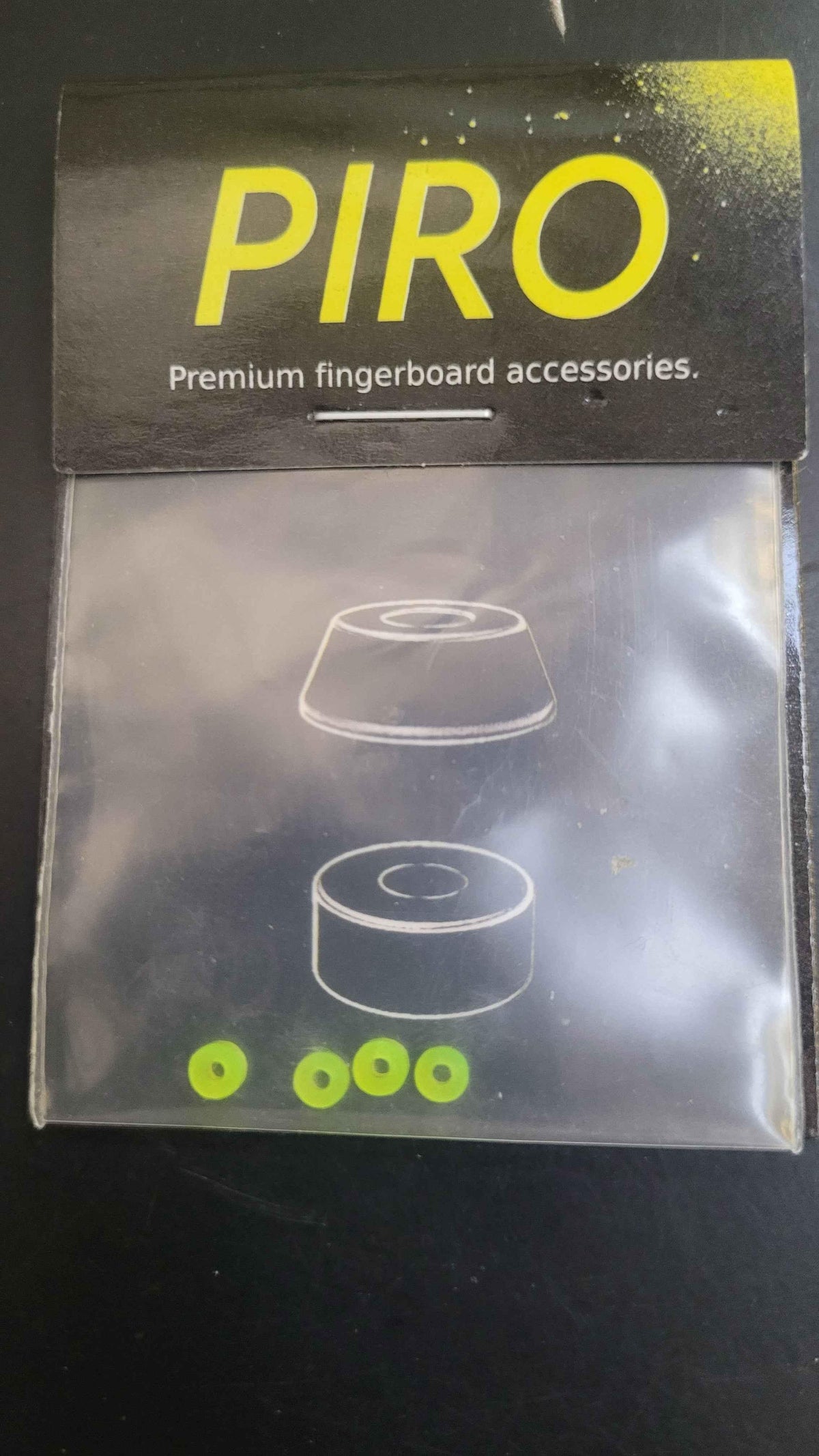 PIRO premium fingerboard accessories package with small green components.