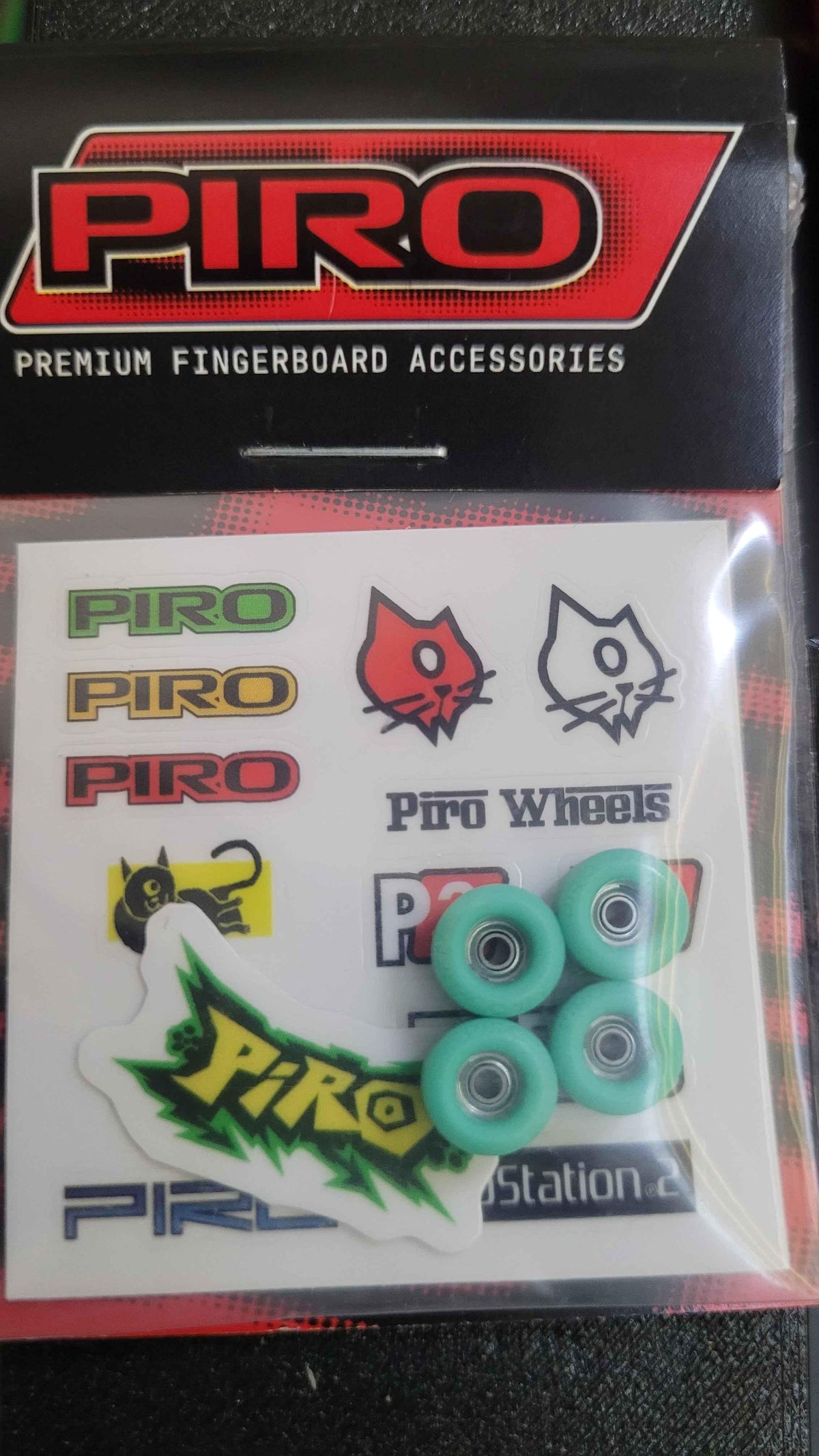 Piro brand premium fingerboard wheels and assorted logo sticker pack.