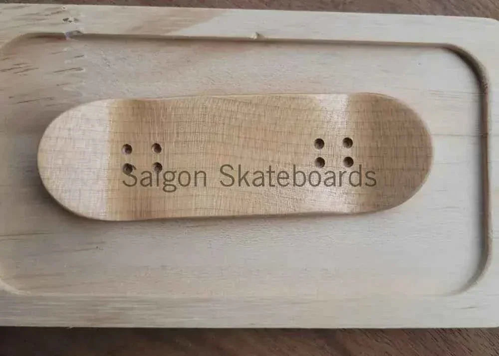 Handmade wooden fingerboard deck with Saigon Skateboards engraving in a wooden case