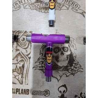 Purple custom fingerboard trucks and white fingerboard wheels on a graphic deck.