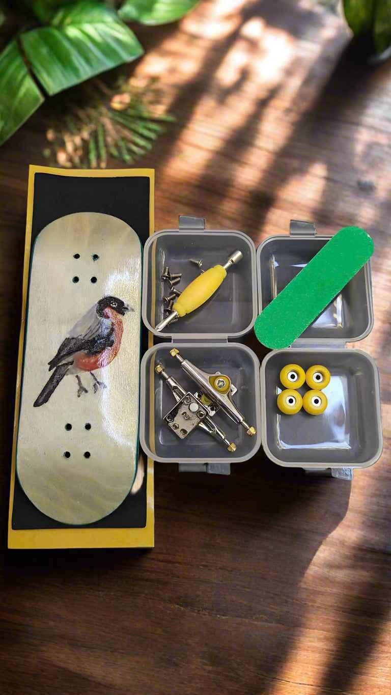 Custom handmade fingerboard deck with bird graphic and miniature skate accessories kit.