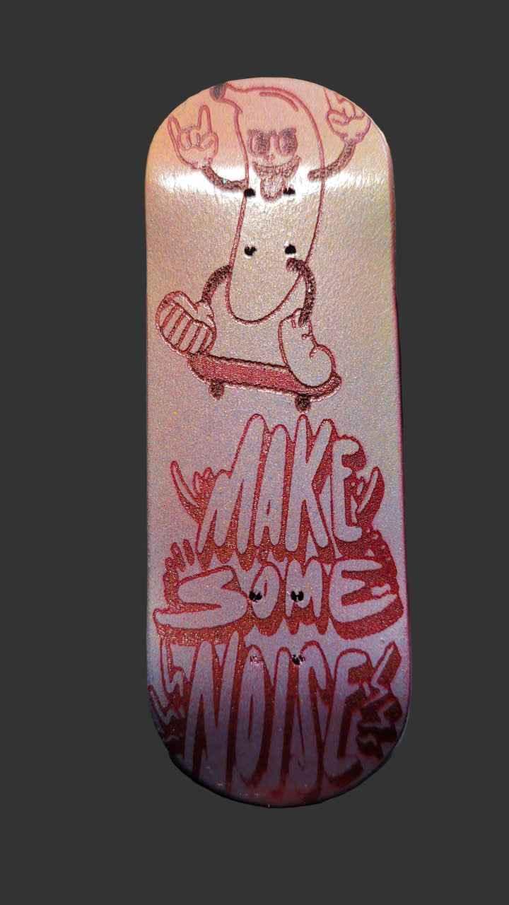 Custom fingerboard deck featuring a skeleton hot dog graphic and 'MAKE SOME NOISE' text.