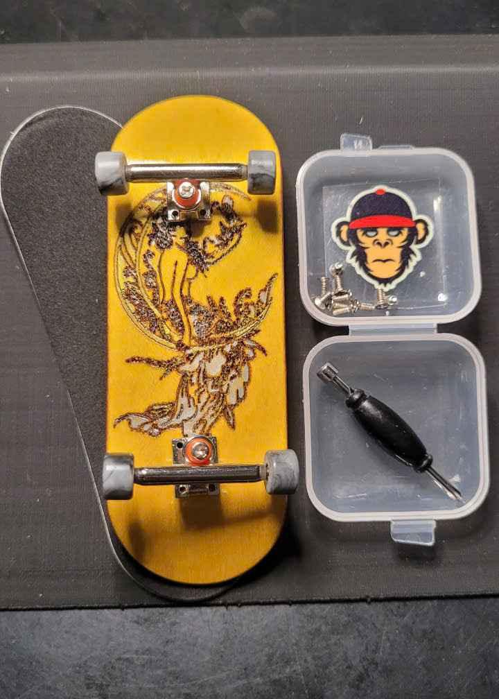 Custom yellow fingerboard deck with graphic, trucks, wheels, and maintenance tools in a case.