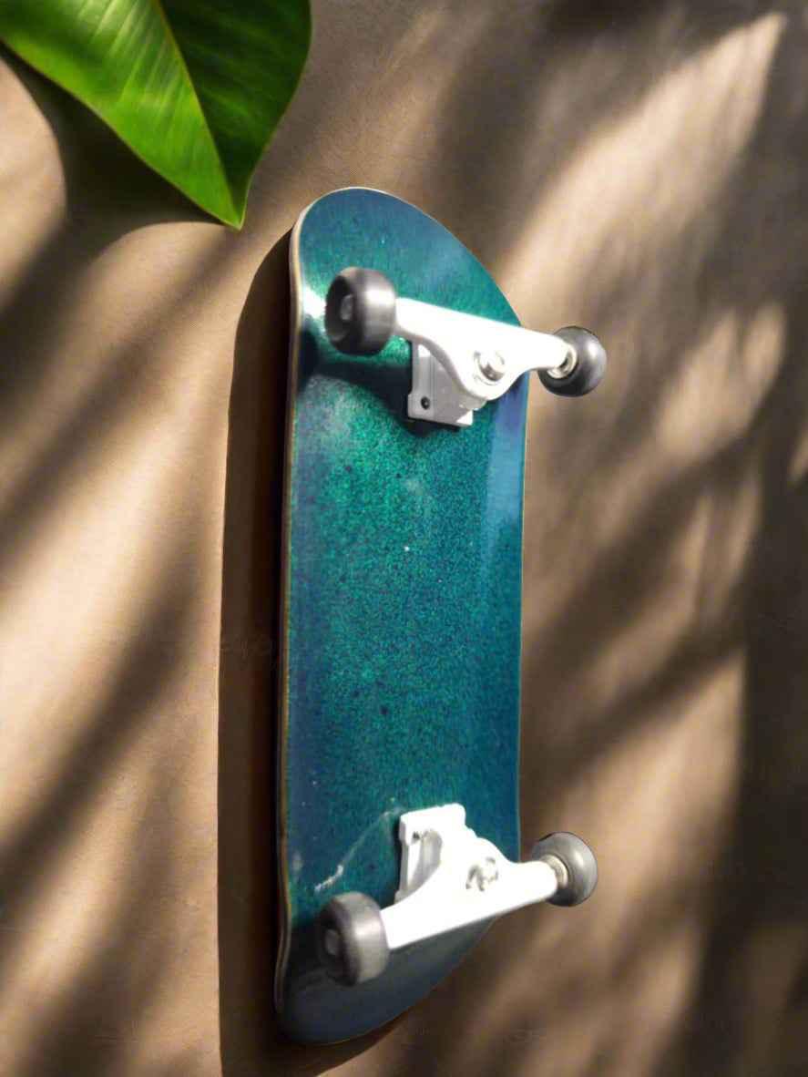 Teal and blue gradient custom fingerboard deck with silver trucks and white wheels