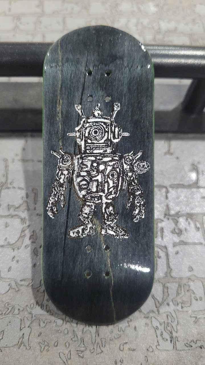 Custom handmade fingerboard deck with a white robot graphic on dark wood grain.