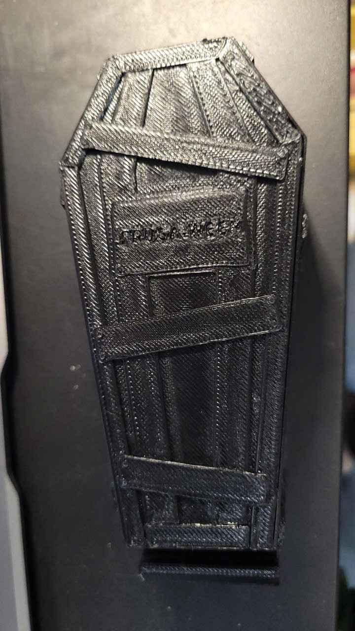 3D printed black miniature coffin accessory for fingerboards