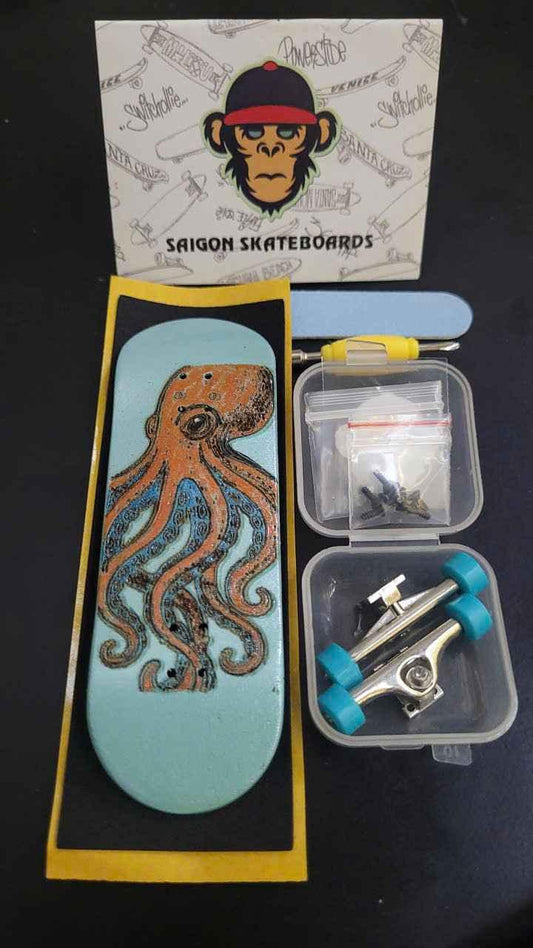 Custom handmade fingerboard deck with octopus graphic, mini trucks, and wheels set.