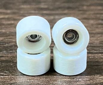 Fingerboard wheels representing the evolution from plastic toys to precision performance components