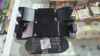 Black custom mold tray with central cavity and round end pieces