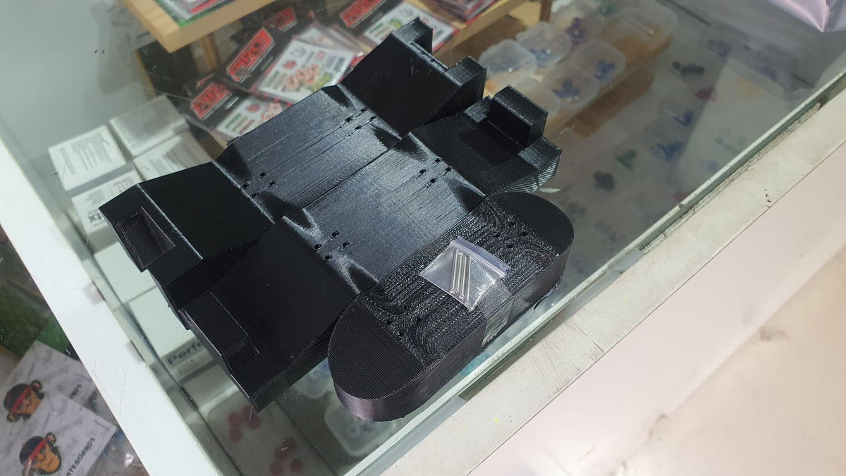 Black custom mold with stacked blocks and smooth curved base