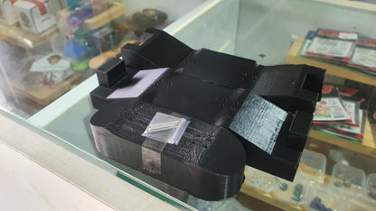 Black 3D-printed mold with rectangular blocks and curved cylindrical ends