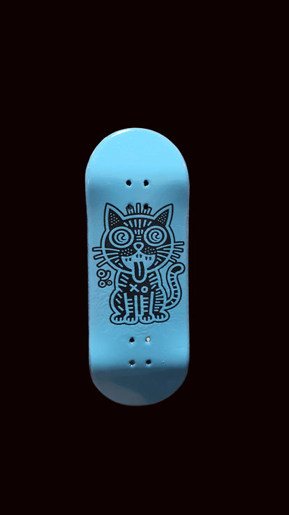 Skateboard fingerboard deck, blue top with outlined cat face and grip holes