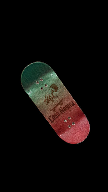 Green-to-red fingerboard deck with Cosa Nostra logo graphic and 4 mounting holes