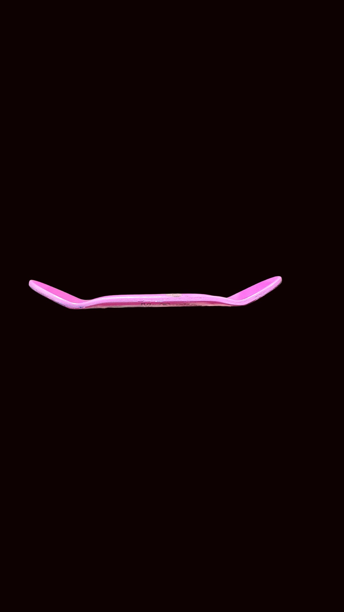 Pink fingerboard deck edge profile with no graphic visible