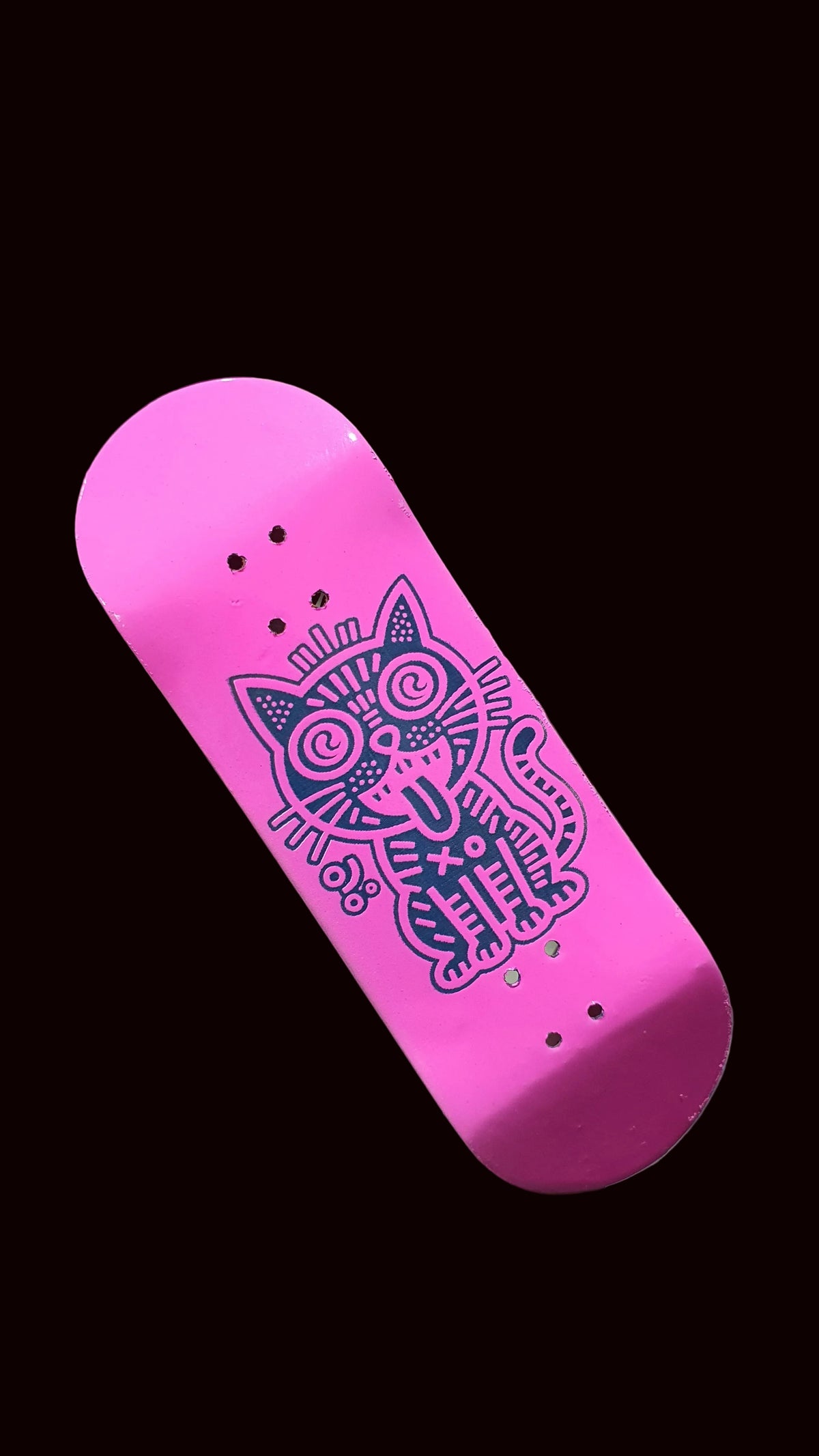 Pink fingerboard deck with centered purple cat illustration and bolt holes